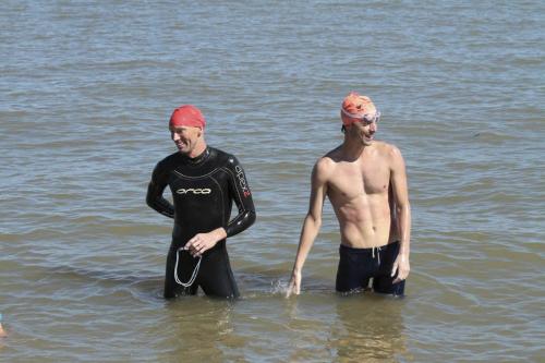 Patrick Peacock, left, and Jacques Marcoux, arrive in Gimli after swimming across Lake Winnipeg 31 km from Gimli to Victoria Beach Saturday, August 13, 2011. Steven Stothers photo - winnipeg free press
