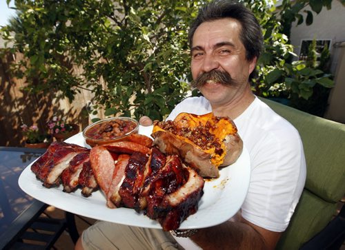 Bernie's BBQ Ribs ,  Sweet Potatoes , and Burbon Maple Beans  Bernie Lutz of Smokin Hawg BBQ  , last years winner  of the rib portion of the Manitoba Open  Barbecue  Competition , ( KEN GIGLIOTTI  / WINNIPEG FREE PRESS ) Aug 18 2011