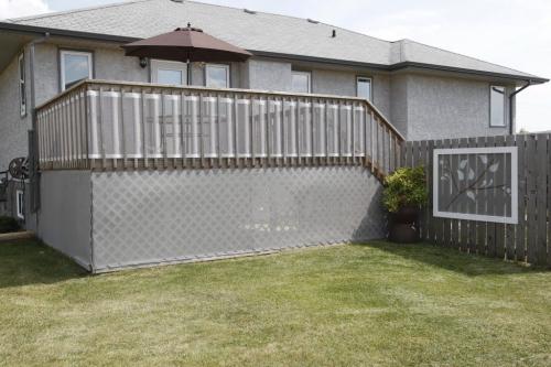 Brenda Goran runs a unique business called Design Equations that makes mesh tarps for houses .  August 11, 2011 (BORIS MINKEVICH / WINNIPEG FREE PRESS)