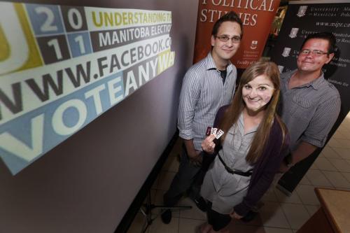 University of Manitoba political science students (Lto R) Jared Dudar, Suzie De Luca, and Al Klassen pose for a photo at their booth after talking to shoppers at St. Vital Shopping Centre about voting in the upcoming Manitoba election in Winnipeg Friday, August 19, 2011. John Woods/Winnipeg Free Press