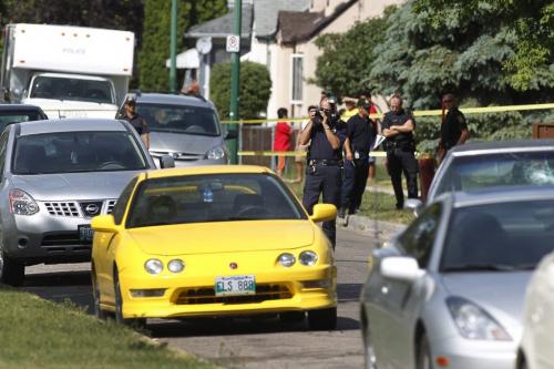 Police investigate a fatal dispute that occurred in the early morning in the 1000 block of Garfield in Winnipeg's West End Saturday, August 20, 2011. Six people were taken to hospital and one has succumbed to their injuries.  John Woods/Winnipeg Free Press