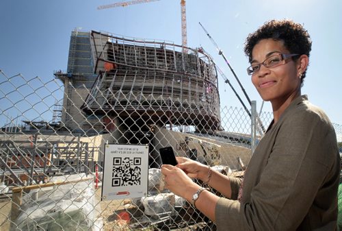 Angela Cassie, Canadian Museum for Human Rights spokesperson uses a smartphone to read a QR code which goes to the Museum's website and a audio file that talks about the Museum. This allows anyone to go on a visual and audio tour of the Museum while it is still under construction. See Bruce Owen story 110823 - Tuesday, August 23, 2011 -  (MIKE DEAL / WINNIPEG FREE PRESS) CMHR
