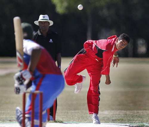 Canadian team bowler Arminder Atwal in the delivery to Bermuda batsman during the last game of the International Cricket Conference Americas Under-15 Northern Division cricket tournament at the Assiniboine Park Cricket Pitch Friday.    Ashley Prest story (WAYNE GLOWACKI/WINNIPEG FREE PRESS) Winnipeg Free Press August 26 2011