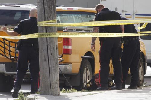 Police attend a stabbing call on Main Street between Dufferin and Jarvis in Winnipeg Saturday, August 27, 2011.   John Woods/Winnipeg Free Press