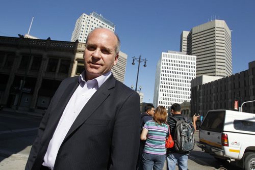 Dave Angus,President and CEO of the Winnipeg Chamber of Commerce, poses for a photo on Portage Ave. in front of the Chamber.  August 28, 2011 (BORIS MINKEVICH / WINNIPEG FREE PRESS)