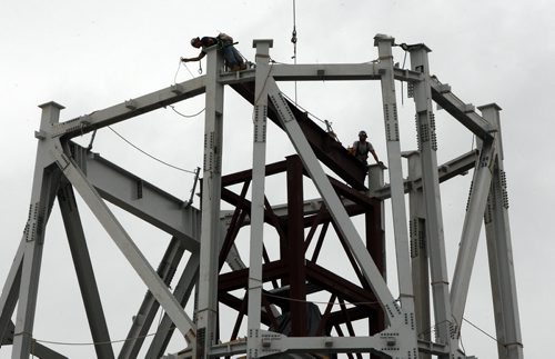 Iron workers guide in steel to construct the 23 storey high tower of hope at the 310 Million dollar Canadian Museum for Human Rights under construction at the Forks in Winnipeg-The Museum is planned to be completed in 2012- Standup photo August 31, 2011   (JOE BRYKSA / WINNIPEG FREE PRESS) CMHR