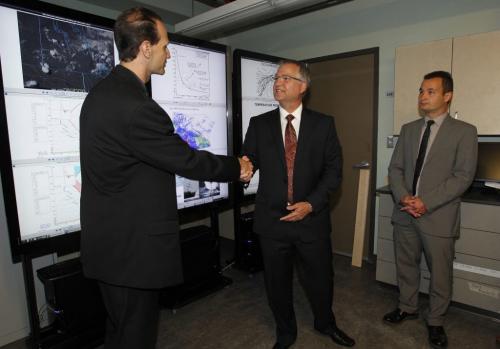 Government of Canada announces new investment in research at the University of Manitoba. Dr. John Hanesiak, professor in Clayton H. Riddell Faculty of Enviroment, Earth, and Resources, shows some weather stuff to Minister Gary Goodyear, Minister of State for Science + Technology, and Winnipeg South MP Rod Bruinooge.   September 1, 2011 (BORIS MINKEVICH / WINNIPEG FREE PRESS)