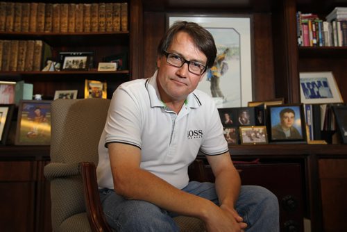Profile of Patrick Cooney in his Exchange Tower office  with photo's of his family and two sons behind him that were his inspiration in naming his company.    See Money Matters profile - Joel  Sept 01, 2011 (RUTH BONNEVILLE / WINNIPEG FREE PRESS)