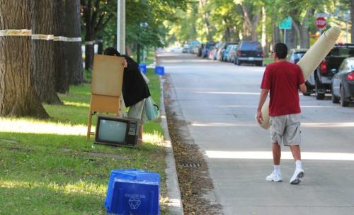 A couple check out the offerings during Giveaway Weekend in Wolseley. 110910 Mike Deal / Winnipeg Free Press