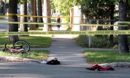 A bicycle and clothing sit at the scene of a stabbing that occurred around 2:30 this morning at the College and Aikins. Police report that a 15-yr-old is in critical condition suffering from multiple stab wounds 110910 Mike Deal / Winnipeg Free Press