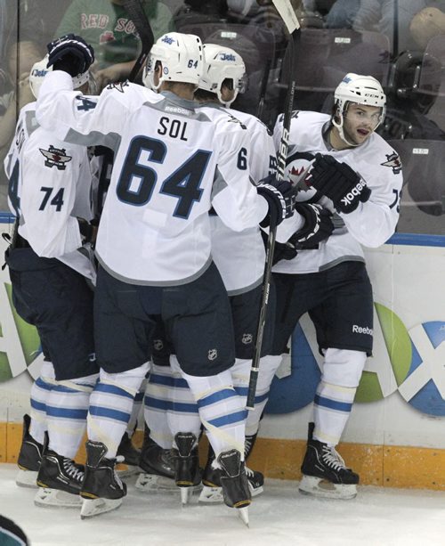 Winnipeg Jets' Levko Koper (73) on the right is congratulated after scoring Winnipeg's first goal.  The rookies for the Winnipeg Jets and the San Jose Sharks took to the ice at South Okanagan Events Centre arena in the Young Stars tournament in Penticton, BC, Monday evening. 110912 - Monday, September 12, 2011 -  (MIKE DEAL / WINNIPEG FREE PRESS)