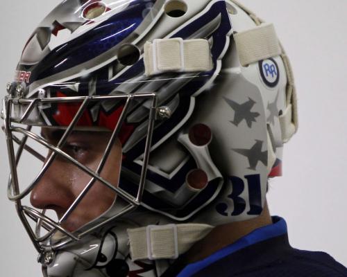 Winnipeg Jets goalie Ondrej Pavelec has a RR with a black circle around it on the back of his helmet. Winnipeg Jets forward Rick Rypien was found dead earlier this year from an apparent suicide.  Sept 12, 2011 (BORIS MINKEVICH / WINNIPEG FREE PRESS)