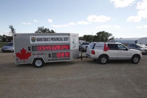 Taxpayer.com manitoba debt trailer at a Greg Selinger event.  Sept 13, 2011 (BORIS MINKEVICH / WINNIPEG FREE PRESS)