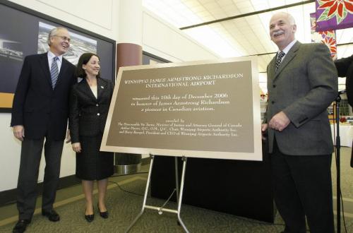 John Woods / Winnipeg Free Press /December 12, 2006 - 061212  - On  Sunday Dec 12/06 at the Winnipeg International Airport (LtoR) Hartley Richardson, Carolyn Hursh, grand children of James Richardson and Vic Toews, Minister of Justice, unveil a plaque at a press conference to announce that the airport will now be named the Winnipeg James Armstrong Richardson International Airport.