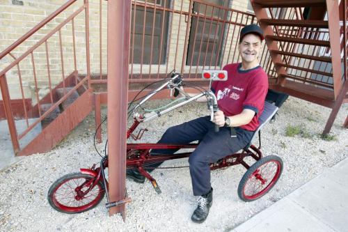Brian Burling poses for a photo on his bike. The disabled man with the help of police recovered the bike that was stolen earlier. Sept. 18, 2011 (BORIS MINKEVICH / WINNIPEG FREE PRESS)