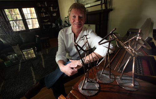Singer Songwriter Doug Edmonds with "his stuff" a piano, wire sculpture misical trio and the jeans he wears to his gigs..... Sept 22, 2011 (Phil Hossack / Winnipeg Free Press)