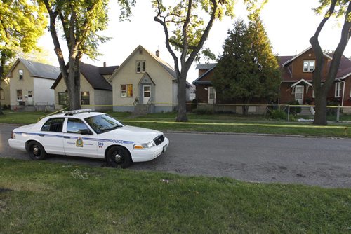 Police on the scene on the 500 block of Boyd Avenue after someone was found dead early this morning, September 25th, 2011. (TREVOR HAGAN/WINNIPEG FREE PRESS) David Michael Vincett, 20, shot and killed