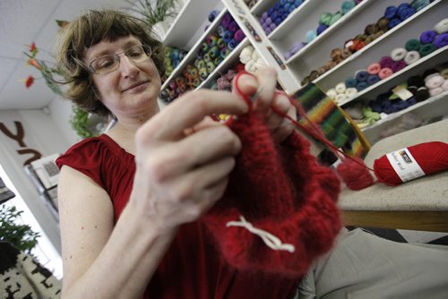 Lori Franko, member worker at Ram Wool, knits a hat as part of Culture Days in Winnipeg Saturday, October 1, 2011.  (John Woods/Winnipeg Free Press)