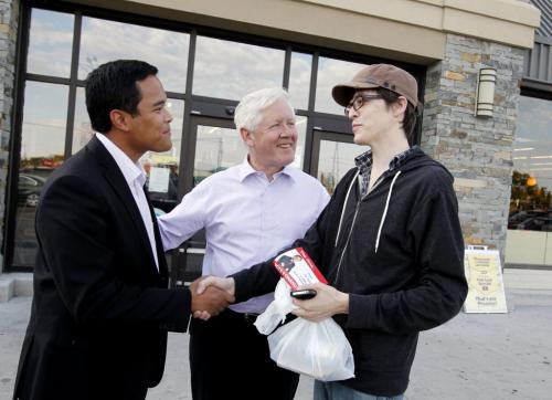 ELECTION - Roldan C. Sevillano and Bob Rea meet people in front of the Safeway in Tyndall Park. Man on right perfered not to have name published (Winnipeg Sun's Sabastian Perth).  Oct. 2, 2011 (BORIS MINKEVICH / WINNIPEG FREE PRESS)