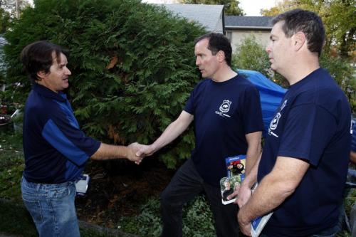 ELECTION - Hugh McFadyen, centre, and St. Vital PC candidate Mike Brown, right, work the streets in St. Vital. Here St. Vital resident Harold Rivard in photo, left. Oct. 3, 2011 (BORIS MINKEVICH / WINNIPEG FREE PRESS)