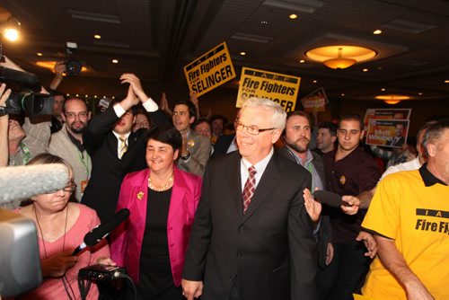 Premier Greg Selinger is all smiles as he walks into the Convention Centre ballroom with his wife to celebrate with hundreds of supporters after winning the provincial election Tuesday night. Election Coverage, See Bruce Owen's story Oct 4, 2011 Ruth Bonneville  Winnipeg Free Press