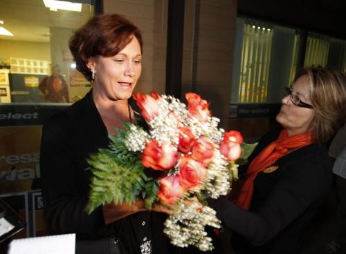 MANITOBA ELECTION 2011 - NDP Theresa Oswald holds a bouquet of roses given to her by a NDP supporter in front of her Seine River riding office at 1-1549 St. Marys Road. She won over ex city councillor Gord Steeves.  Oct. 4, 2011 (BORIS MINKEVICH / WINNIPEG FREE PRESS)