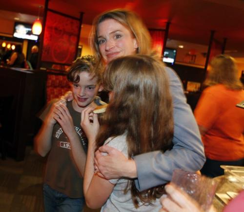ELECTION - NDP Erin Selby with her kids Hayden and Avery celebrate her Southdale riding win at the Southdale Pizza Hut at Fermor and Lakewood. Selby fended off PC candidate Judy Eastman.  Oct. 4, 2011 (BORIS MINKEVICH / WINNIPEG FREE PRESS)