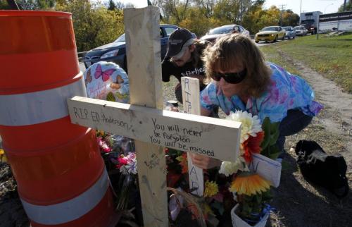 Lorna Bouchard, mother of Ed Anderson, the tow truck driver who died with his girlfriend on Dugald Road, at the crash memorial for the first time. Location is Dugald and Plessis. Lorna is on the right in photo. Guy on the left is an old friend from the tow truck industry named Kevin Pearson. Oct. 5, 2011 (BORIS MINKEVICH / WINNIPEG FREE PRESS)