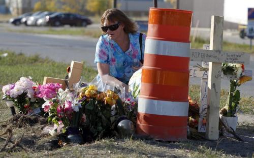 Lorna Bouchard, mother of Ed Anderson, the tow truck driver who died with his girlfriend on Dugald Road, at the crash memorial for the first time. Location is Dugald and Plessis. Oct. 5, 2011 (BORIS MINKEVICH / WINNIPEG FREE PRESS)