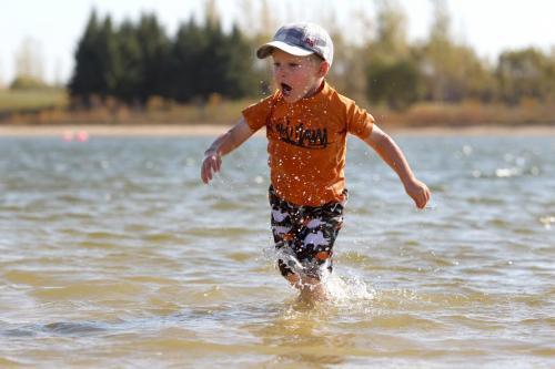 Three year old Owen Eisbrebber runs through the refreshing cool water i at Birds Hill Park Wednesday as the unseasonal warm fall weather continues.   See story by Melissa Martin  Oct 05, 2011 Ruth Bonneville  Winnipeg Free Press