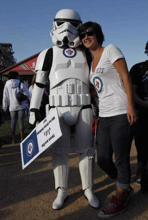 NHL Faceoff 2011 at the Forks. A Stormtrooper poses with people at the Forks. The Imperial Stormtroopers are fictional soldiers from George Lucas' Star Wars universe. Oct. 6, 2011 (BORIS MINKEVICH / WINNIPEG FREE PRESS)