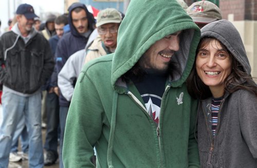 Andrew Lane and  Ildiko Nova  wait in line in the rain outside Siloam Mission  for their turn to attend the annual turkey dinner Thanksgiving Monday- See Melissa Martin story  October 09, 2011   (JOE BRYKSA / WINNIPEG FREE PRESS)