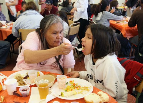 Linda Boucher feeds her granddaughter Sonique, 10 yrs at the annual turkey dinner Thanksgiving Monday at Siloam Mission in Winnipeg- See Melissa Martin story  October 09, 2011   (JOE BRYKSA / WINNIPEG FREE PRESS)