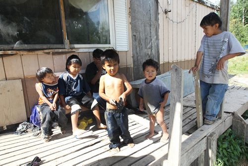 Children outside the trailer of Richard Andrews in Wasagamack First Nation.  It is in filthy condition, has mold and is overpopulated by over 13 people living inside. It has  no running water- See Mary Agnes No Running Water Feature  August 18, 2011   (JOE BRYKSA / WINNIPEG FREE PRESS)