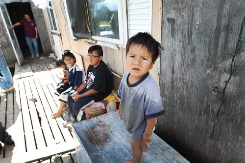 Children outside the trailer of Richard Andrews in Wasagamack First Nation.  It is in filthy condition, has mold and is overpopulated by over 13 people living inside. It has  no running water- See Mary Agnes No Running Water Feature  August 18, 2011   (JOE BRYKSA / WINNIPEG FREE PRESS)