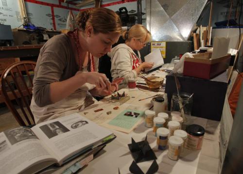Doreen Lapointe is a goldsmith and educator that runs classes in her home and makes interesting art. Here students Lisa Rae Sean and Danielle Law work in the studio class. Oct. 11, 2011 (BORIS MINKEVICH / WINNIPEG FREE PRESS)
