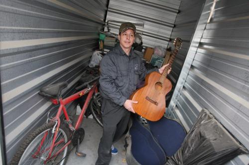 StorageVille KP Inc. auctioned off some abandoned storage rooms. Todd Ryznar looks through some stuff in the container he got for $400.  Oct. 12, 2011 (BORIS MINKEVICH / WINNIPEG FREE PRESS)