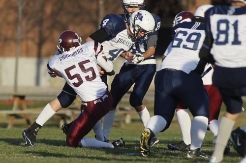 October 21, 2011 - 111021  -  Grant Park Pirate's Damien Surprenant (4) gets sacked by St. Paul Crusader's Shane Thiessen (55) in their WHSFL AA division game at St. Paul's High School Friday October 21, 2011.    John Woods / Winnipeg Free Press