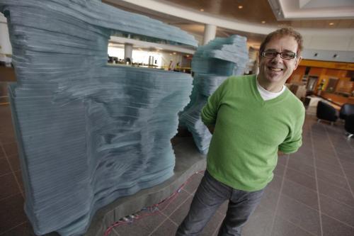 October 21, 2011 - 111021  -  Warren Carther, artist, is photographed with his latest glass creation Aperture Friday October 21, 2011.  The piece is on display at the new airport terminal John Woods / Winnipeg Free Press