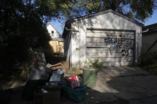 Union Ave. W 300 block. The rear of 318. NOTE FUCK AND OTHER PROFANITIES ON THE GARAGE DOOR. WARNING.   Oct. 23, 2011 (BORIS MINKEVICH / WINNIPEG FREE PRESS)