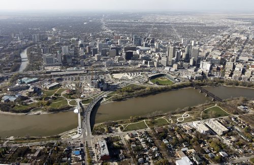 Aerial view of The Forks, The Assiniboine River, The Esplanade Riel and Provencher Bridge over the Red River, The Canadian Museum for Human Rights, Shaw Park, downtown, and Waterfront Drive, October 21st, 2011. (TREVOR HAGAN/WINNIPEG FREE PRESS) CMHR