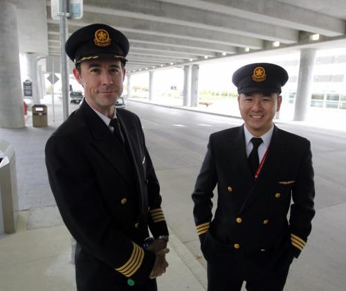 The new Winnipeg James Armstrong Richardson International Airport opens officially. Air Canada flight crew from Toronto Capt. Stephen Moore and first officer Winston Ng.  Oct. 30, 2011 (BORIS MINKEVICH / WINNIPEG FREE PRESS) James Richardson International Airport.