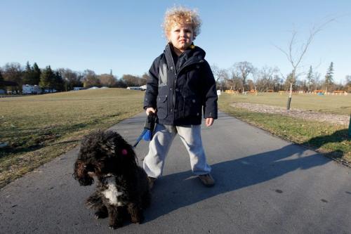 October 28, 2011 - 111028  -  Four year old Ami Banks is photographed with his dog Mia who was allegedly attacked by another dog at Assiniboine Park Friday, October 28 2011. JOHN WOODS / WINNIPEG FREE PRESS
