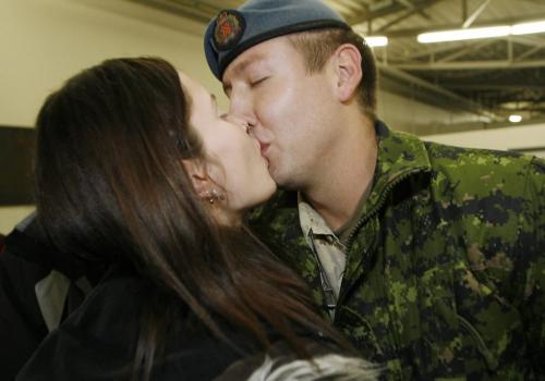 John Woods / Winnipeg Free Press / December 23, 2006 - 061223  - Michael Robertson is welcomed by his fiance Reva Collins in the arrival area of 17th Wing Saturday Dec. 24/06.  Fifty three soldiers arrived back from the secret Camp Mirage which supports troupes in Afghanistan.