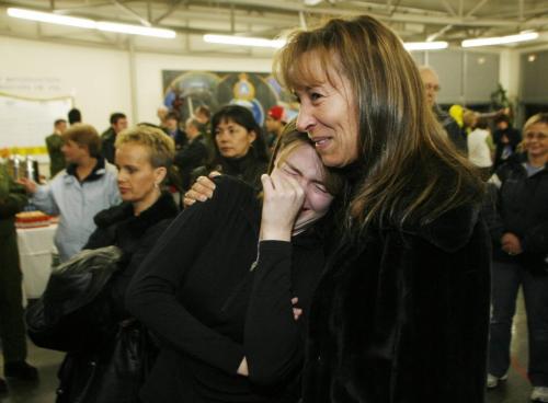 John Woods / Winnipeg Free Press / December 23, 2006 - 061223  - Nancy Gingras comforts Cathy Clavette as they get excited after getting the first glimpses of their husbands Cpl. Daniel Morin and Cpl. Yannick  Guenette in the arrival area of 17th Wing Saturday Dec. 24/06.  Fifty three soldiers arrived back from the secret Camp Mirage which supports troupes in Afghanistan.