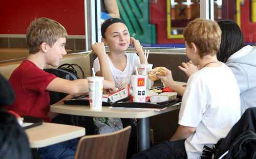Liam, Aby and Griffin (from left) eat out at a fast food restaurant together on their own after shop class Monday. This is the first year that the students are given the independance of their own lockers, moving to different rooms between classes and taking the transit bus on their own to name a few. See 2017 project, Carolin Vesley and Doug Speirs Nov 10,2011 (Ruth Bonneville /  Winnipeg Free Press)