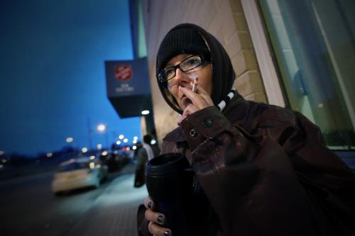 November 10, 2011 - 111110  -  On Thursday, November 10, 2011 Kim, a military veteran, has a smoke outside the Salvation Army shelter which she presently calls home.    John Woods / Winnipeg Free Press