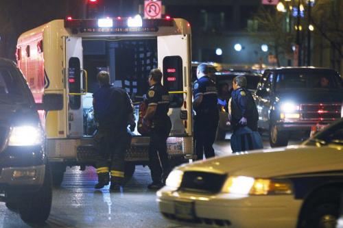 November 12, 2011 - 111112  -  At the corner of Main and McDermott a woman in labour is put in the back of an ambulance after Santa Claus parade in Winnipeg Saturday, November 12, 2011.    John Woods / Winnipeg Free Press