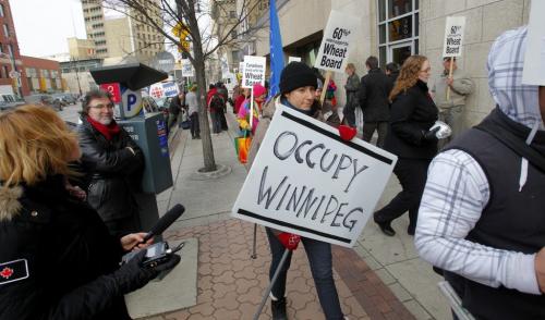 Supporters of the Canadian Wheat Board marched on Parliament Hill and outside the agency's Winnipeg headquarters today. An occupy Winnipeg person at the protest.  November 15, 2011 (BORIS MINKEVICH/ WINNIPEG FREE PRESS)