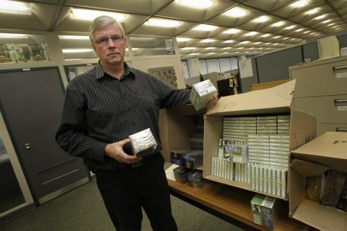 Mike McDonald a member of a special investigations unit of the Finance Department of the Provincial Government with seized cigarettes. 111116 Mike Deal / Winnipeg Free Press